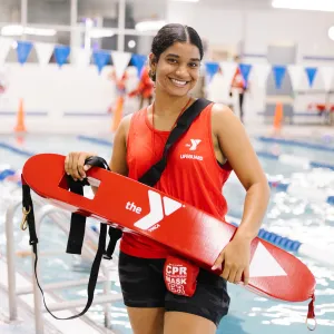 lifeguard smiling in front of pool
