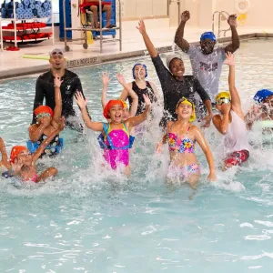 swim class jumps in pool