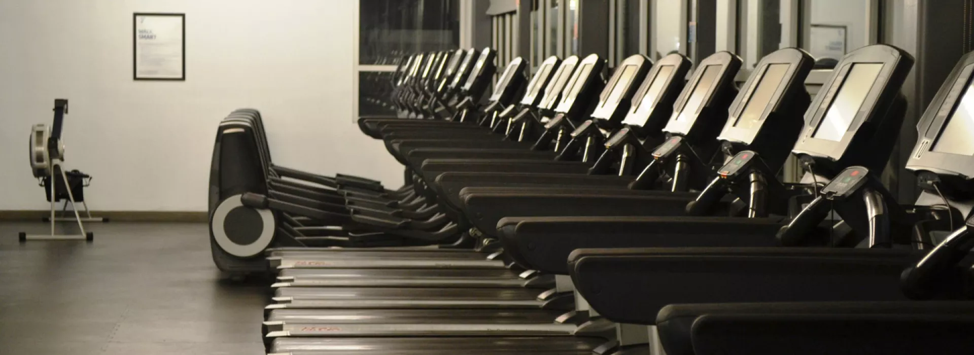A row of treadmills in the gym at Bronx YMCA.