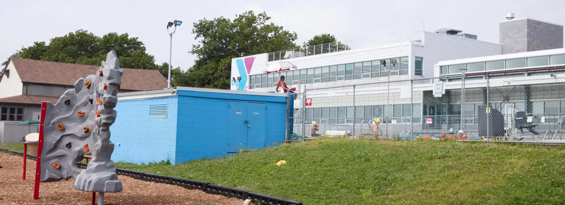 A rock climbing wall in the outdoor playground outside the Bronx YMCA.