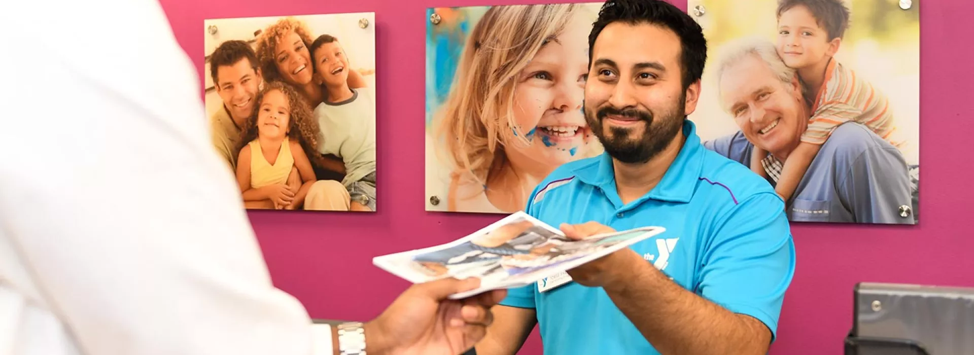 Membership staff helping YMCA member in Manhattan