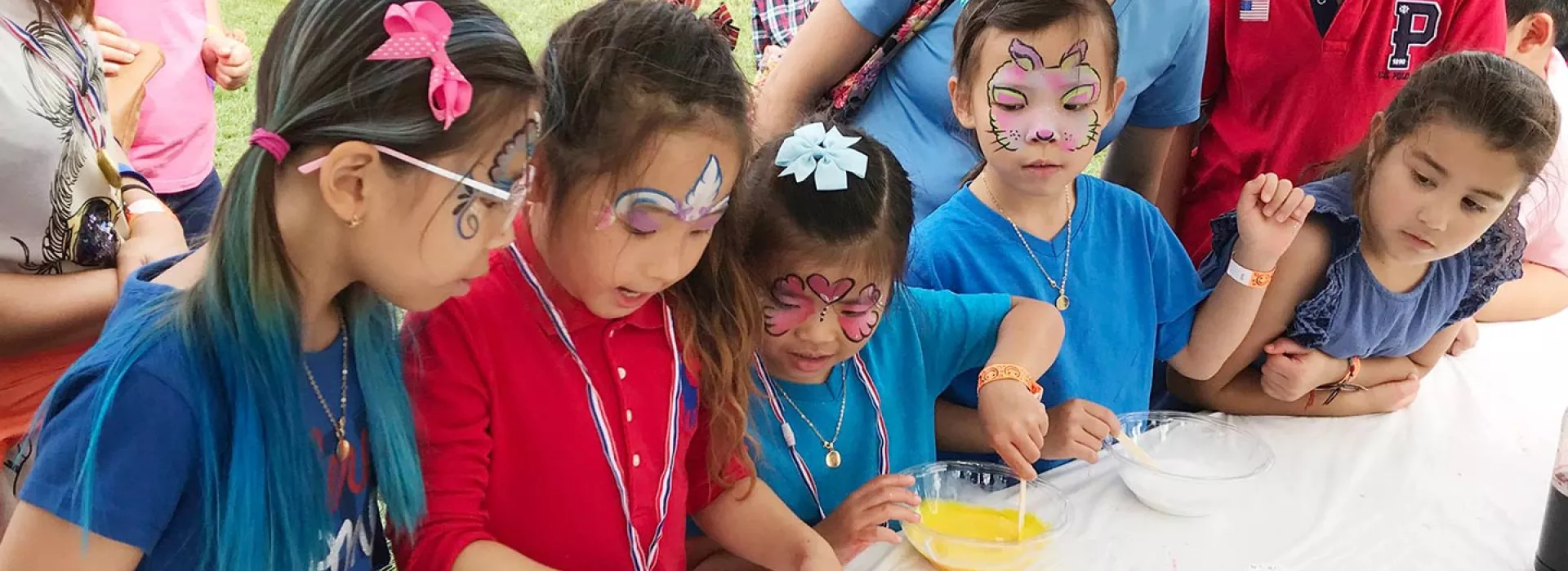 Kids with face painting at Cross Island Touch a Truck event