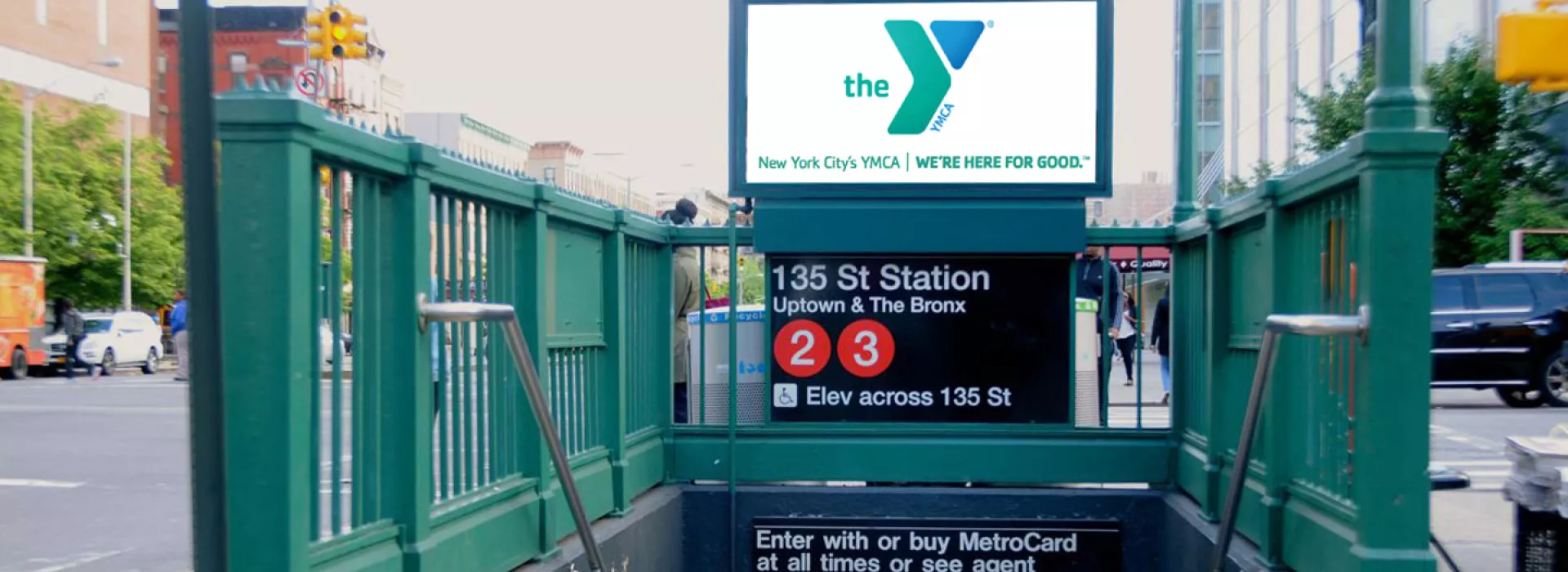 An ad for the YMCA at the Harlem 135 St. Subway station.