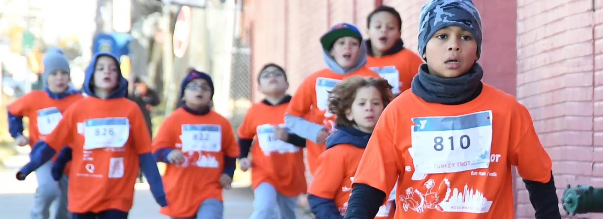 Kids running in LIC YMCA's fun run for kids