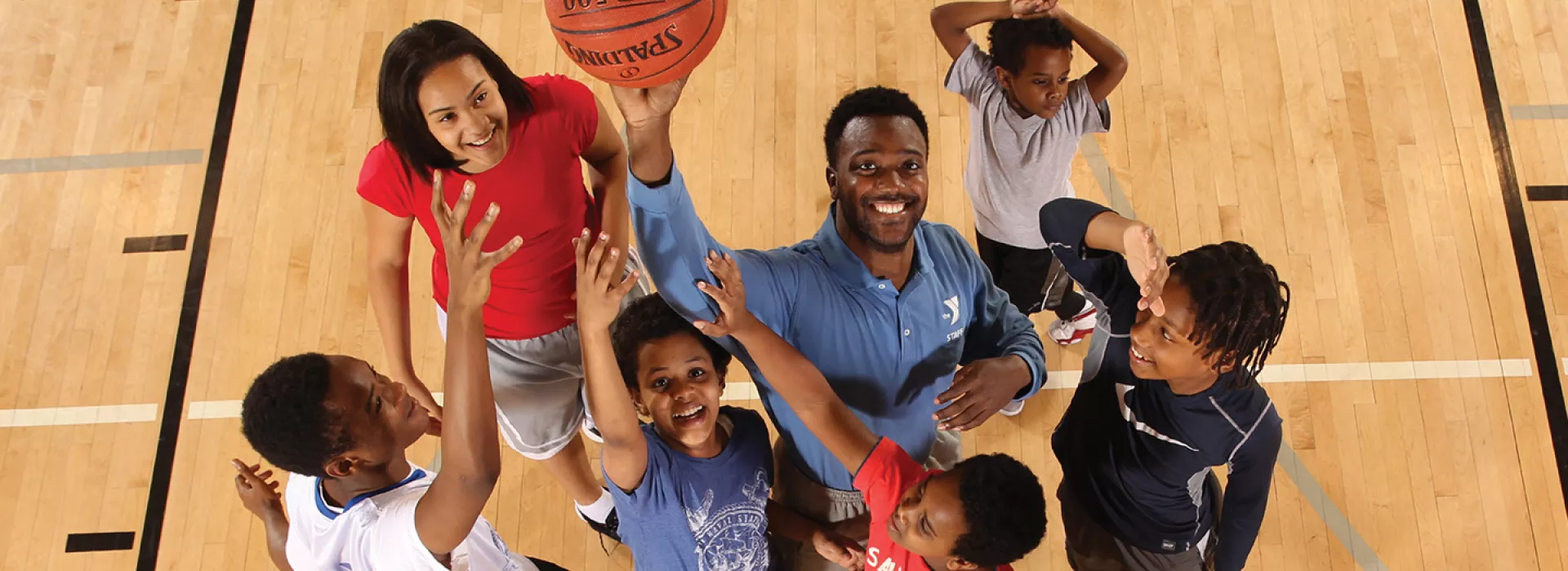 Basketball youth sports class playing at YMCA