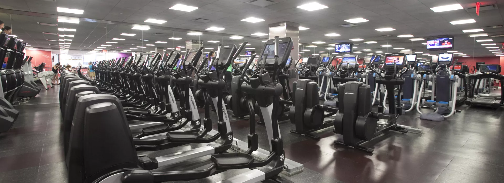 Many rows of state-of-the-art cardio equipment at Vanderbilt YMCA.