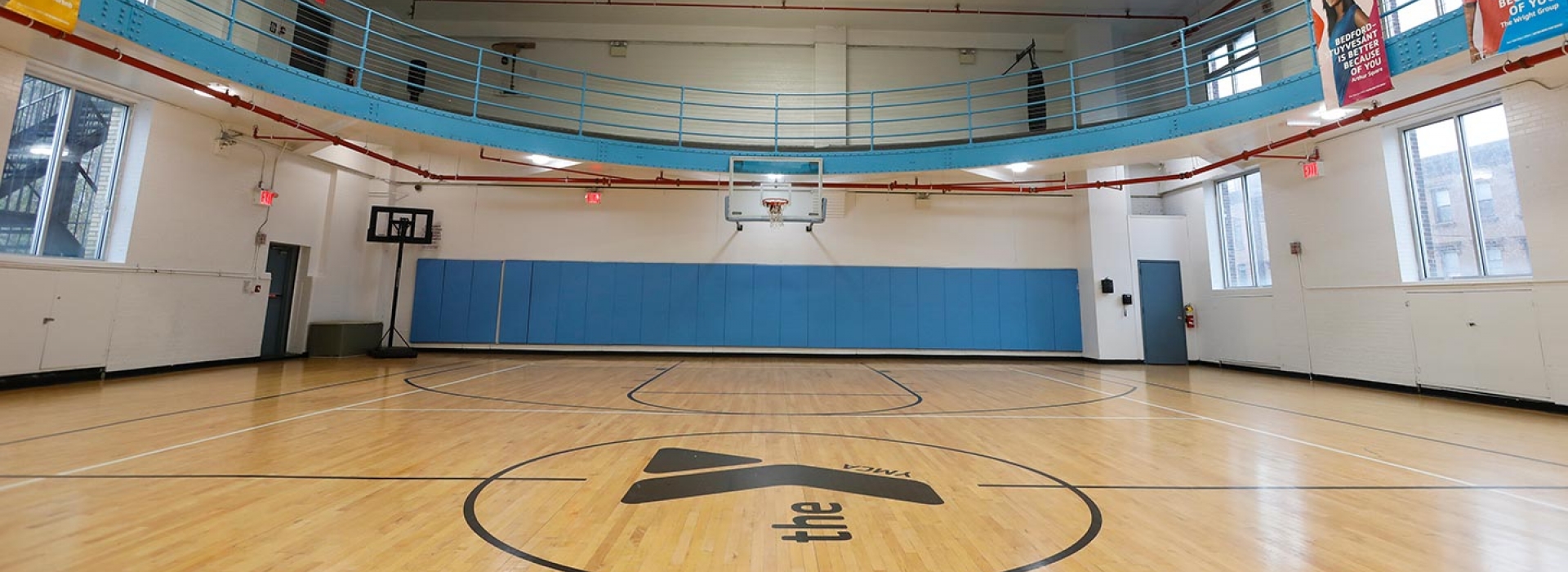 Indoor basketball gymnasium and running track at Bedstuy YMCA
