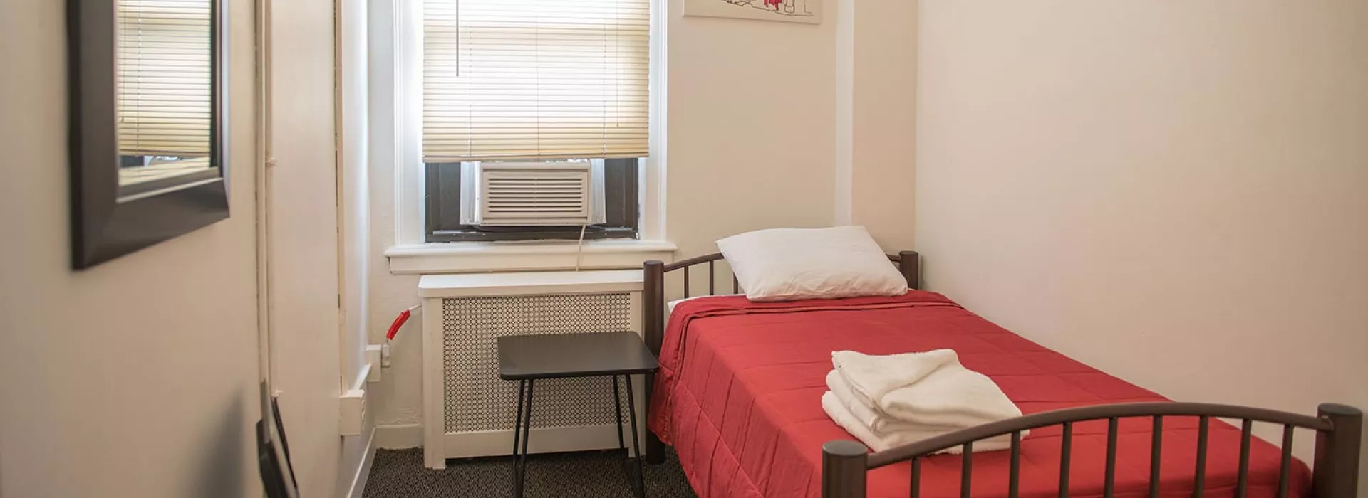 Single bed in guest rooms of Flushing YMCA