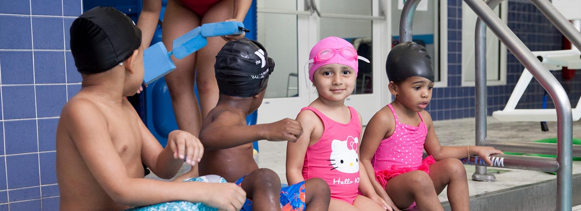Kids on side of indoor pool at Harlem YMCA