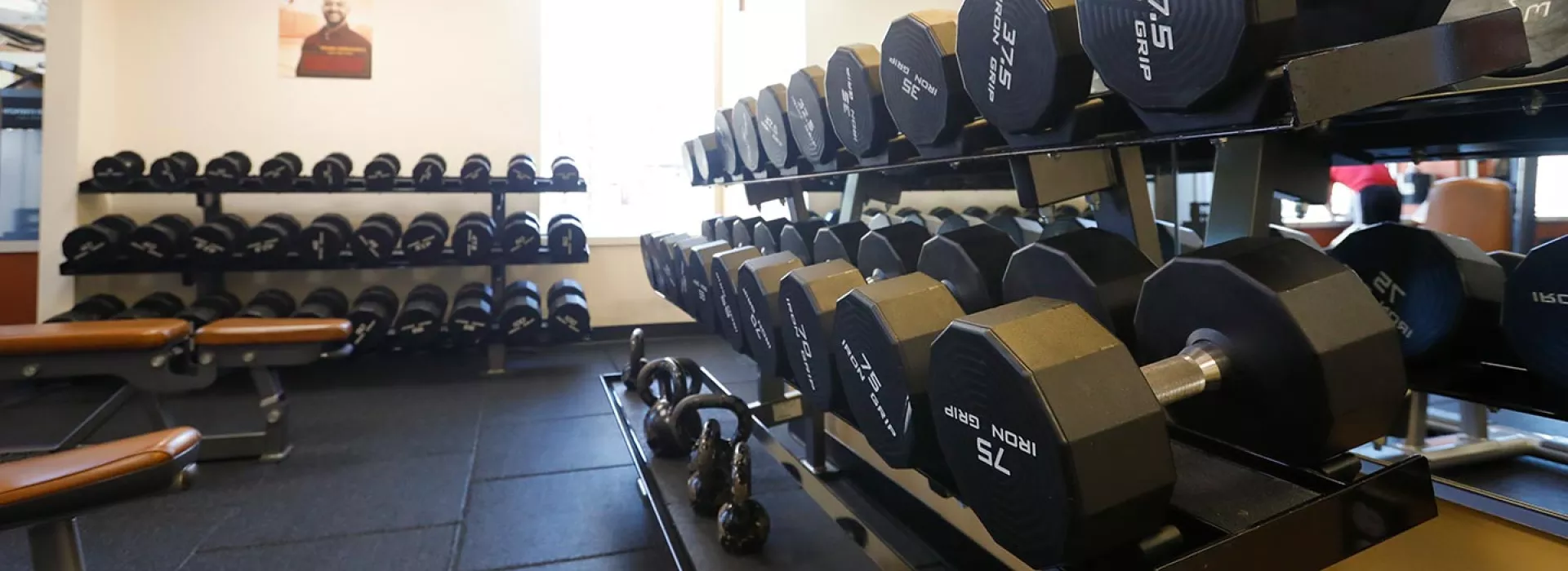 Racks of weights in the strength training center of the Ridgewood YMCA