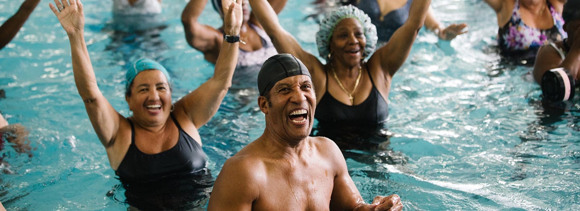 YMCA staff leading water aerobics class at Bronx YMCA indoor pool