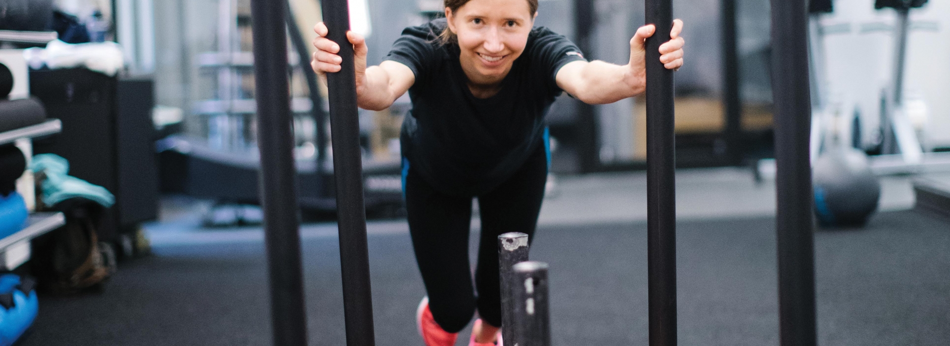 Woman pushing sled