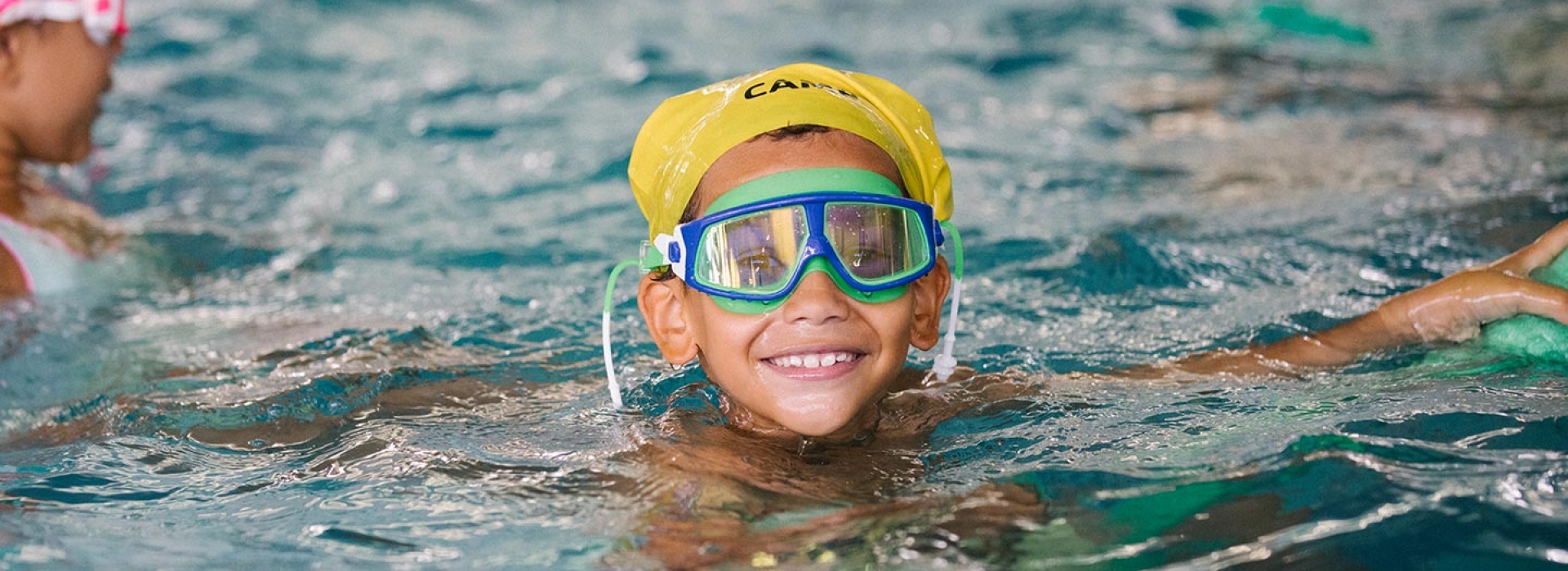 Boy swimming at Castle Hill YMCA indoor pool