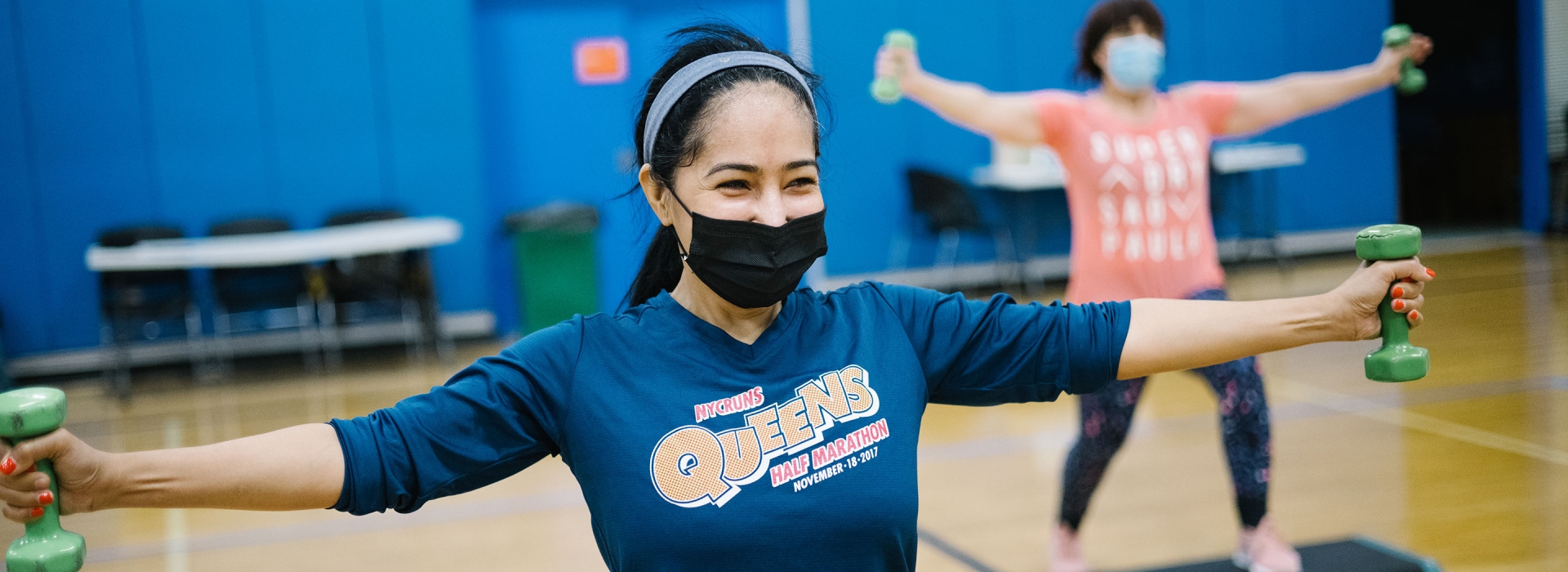 woman in weight class with mask on