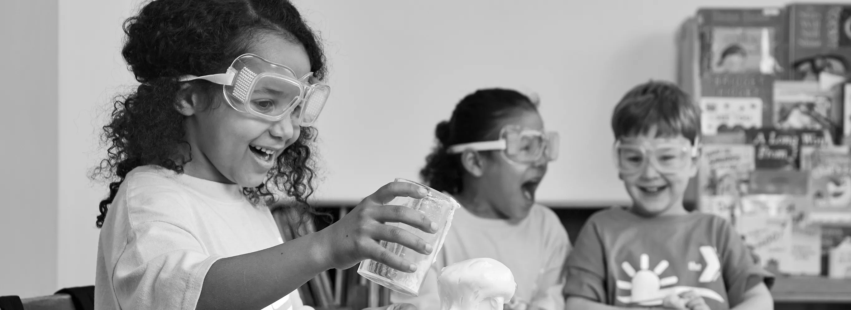 girl holding glass with clay at summer camp