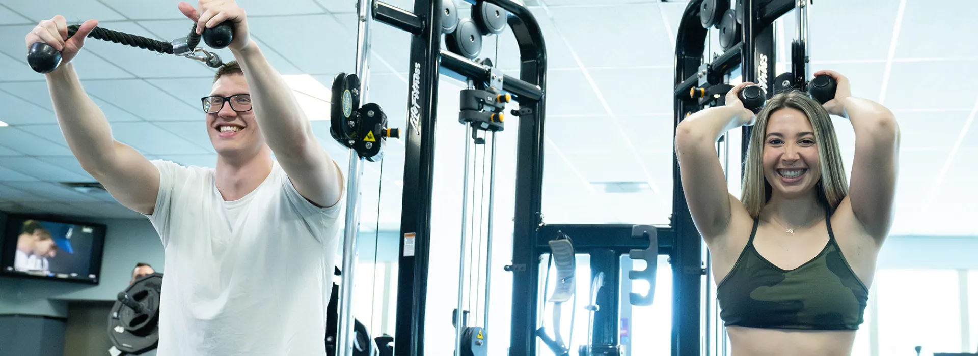 couple working out on fitness machines